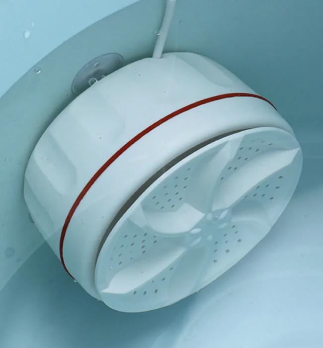 Electric portable washing machine for fast and gentle clothes washing.