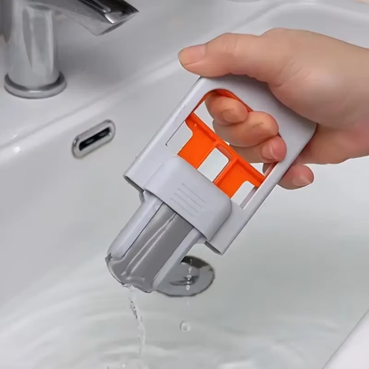 Mini portable mop with self squeezing design for easy cleaning.