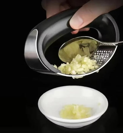Easy use garlic and ginger press tool for daily kitchen cooking.