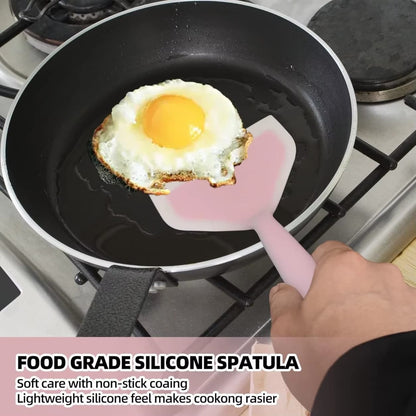 Heat resistant silicone spatula for safe cooking on non-stick pans.