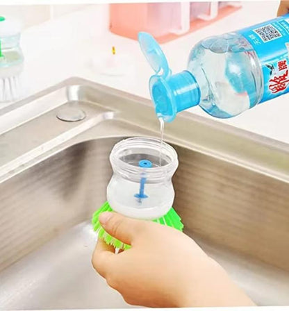 Kitchen dish scrubber brush with liquid soap dispenser for fast cleaning.