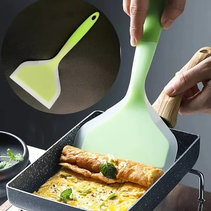 Kitchen silicone spatula tool for mixing, flipping, and serving food easily.