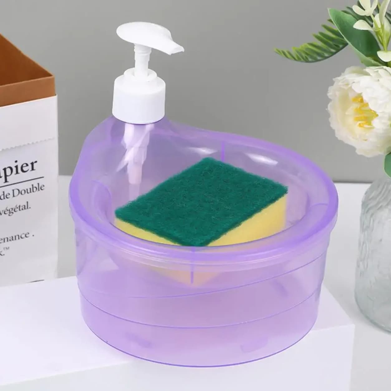Kitchen soap dispenser with sponge holder and easy pump system.