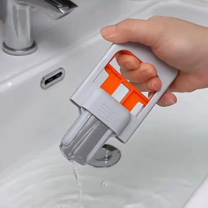 Mini portable mop with self squeezing design for easy cleaning.