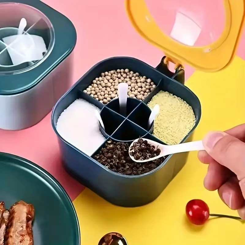 Multi-compartment spice storage box with spoons for easy kitchen use.