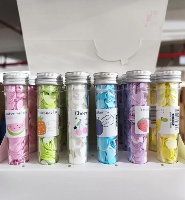 Compact paper soap strips packed in tube for easy carrying in pocket or bag.
