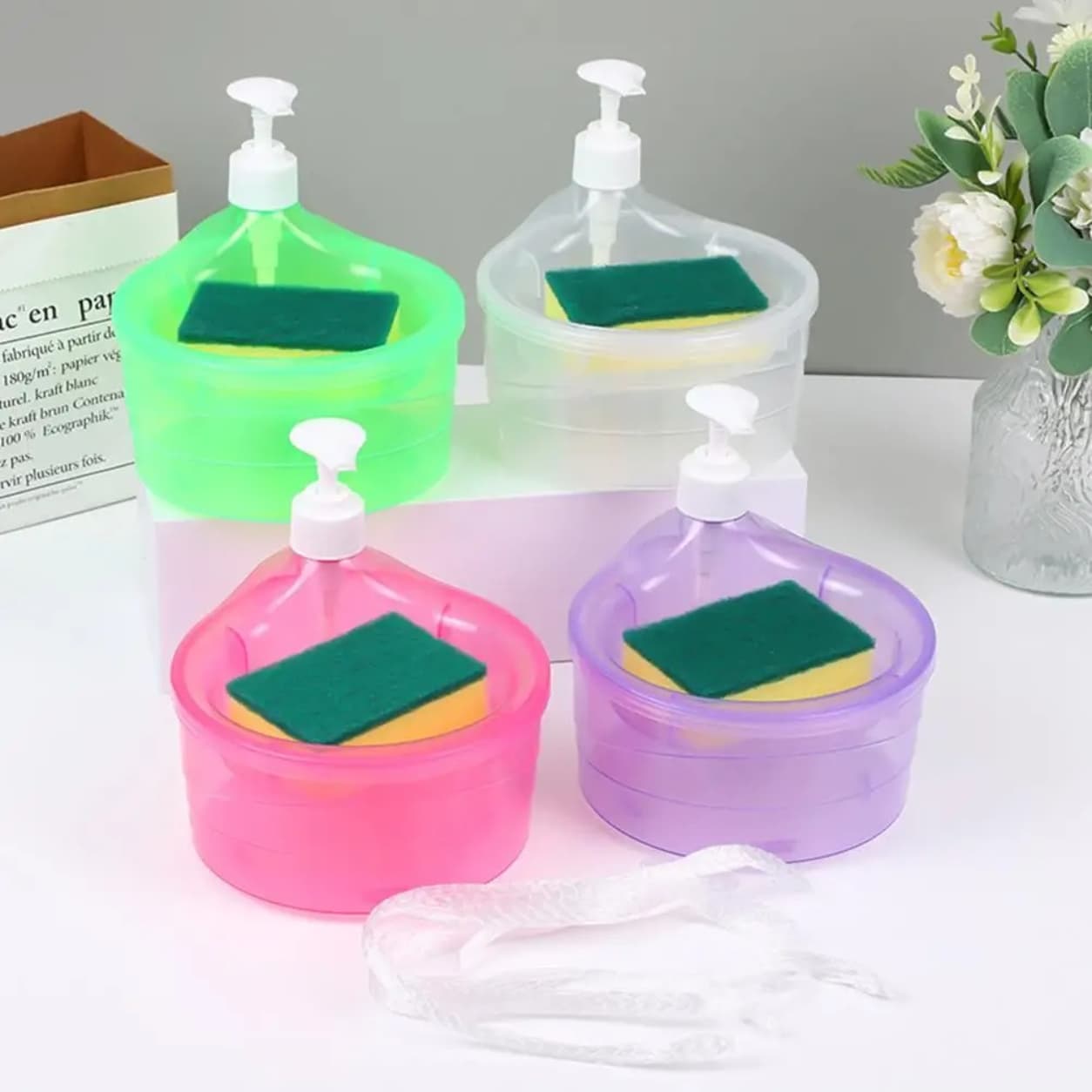 Pump soap dispenser with sponge holder for easy cleaning.