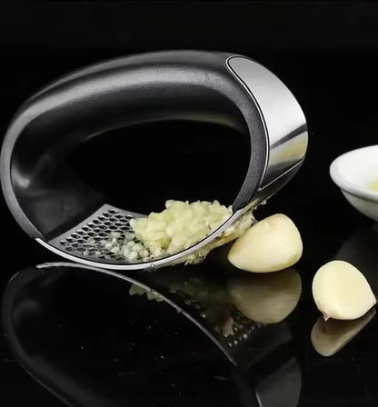 Stainless steel garlic press for strong and efficient crushing.