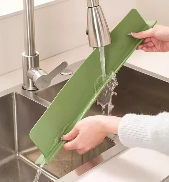 Waterproof sink faucet mat for keeping kitchen counters dry and clean.