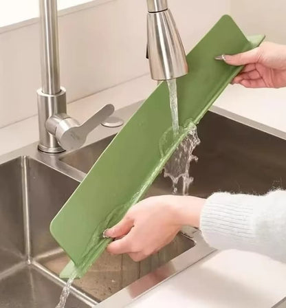 Waterproof sink faucet mat for keeping kitchen counters dry and clean.
