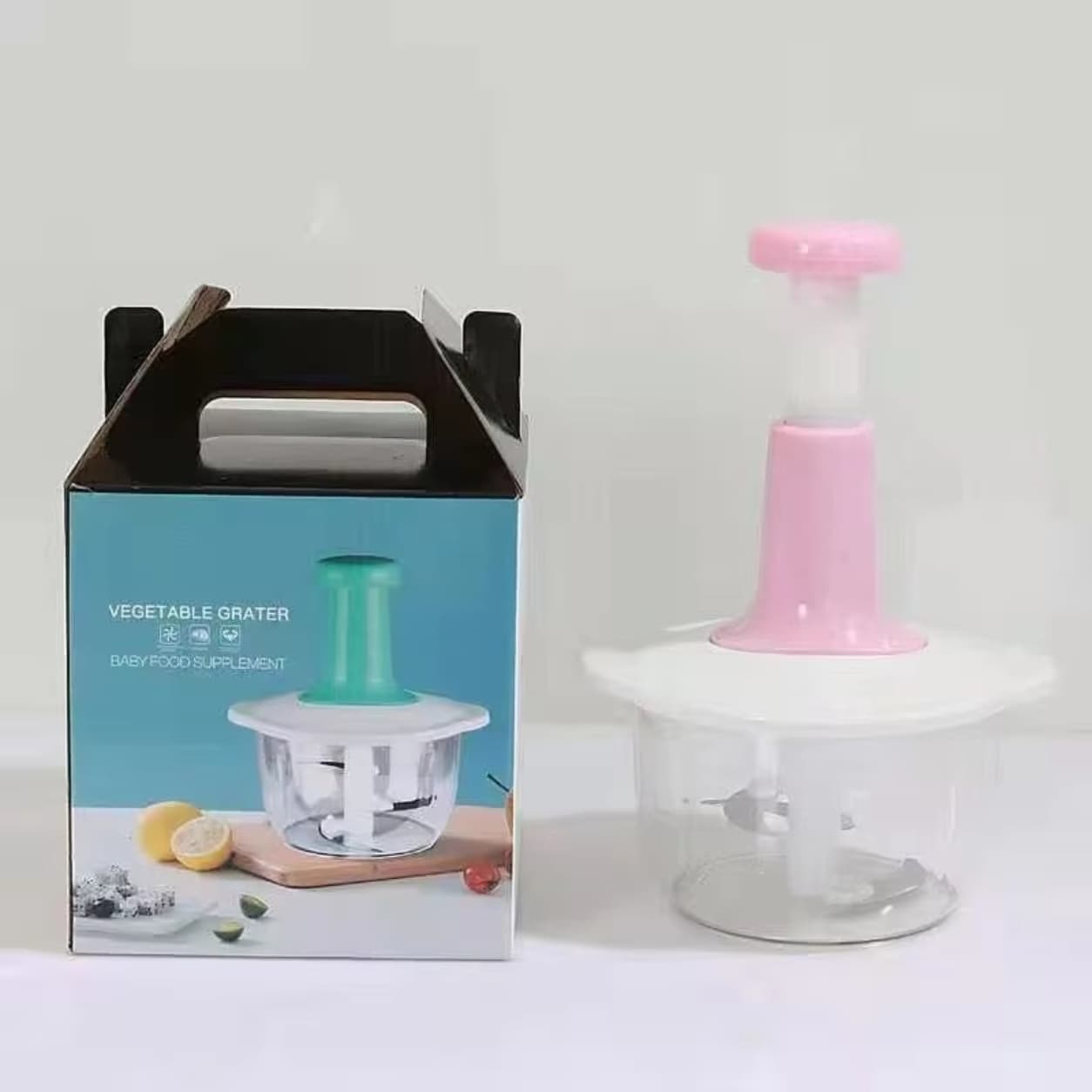 Hand press food chopper for cutting onions, vegetables, and fruits.